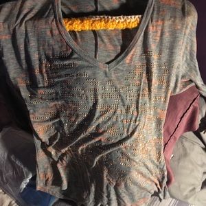 Gray knit top with gold designs